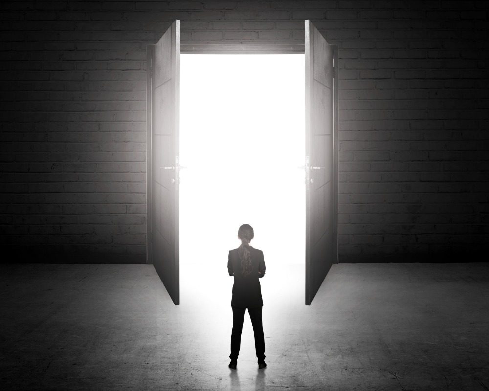 Business woman going to the open door. Career path conceptual